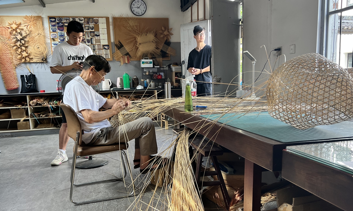 Craftsmen work on bamboo weaving handicrafts in the Zhuyun Workshop in Wuzhen, East China's Zhejiang Province, on June 14, 2023. Photo: Pang Yue/GT