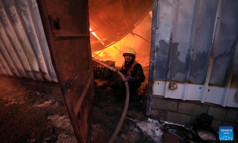 A plastic factory is on fire after Israeli attacks in the southern Gaza Strip city of Khan Younis Dec. 2, 2023. (Photo: Xinhua)