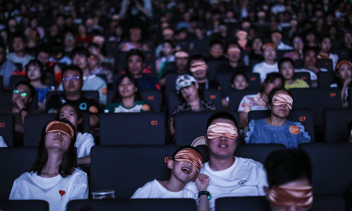 People experience a barrier-free film made for visually impaired audiences in a cinema in Beijing. Photo: Courtesy of Wu Qian