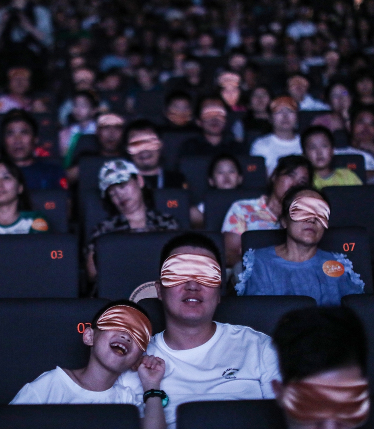 People experience a barrier-free film made for visually impaired audiences in a cinema in Beijing. Photo: Courtesy of Wu Qian