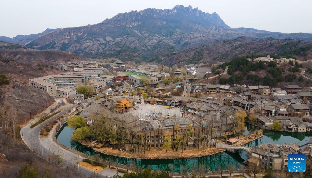 This aerial photo taken on Nov. 15, 2023 shows the Gubei Water Town scenic area at the foot of Simatai section of Gubeikou Great Wall in Beijing, capital of China. Gubeikou Great Wall is located in Gubeikou Town, Miyun District of Beijing. The defense of the Great Wall is an important part of the early Chinese People's War of Resistance Against Japanese Aggression.(Photo: Xinhua)