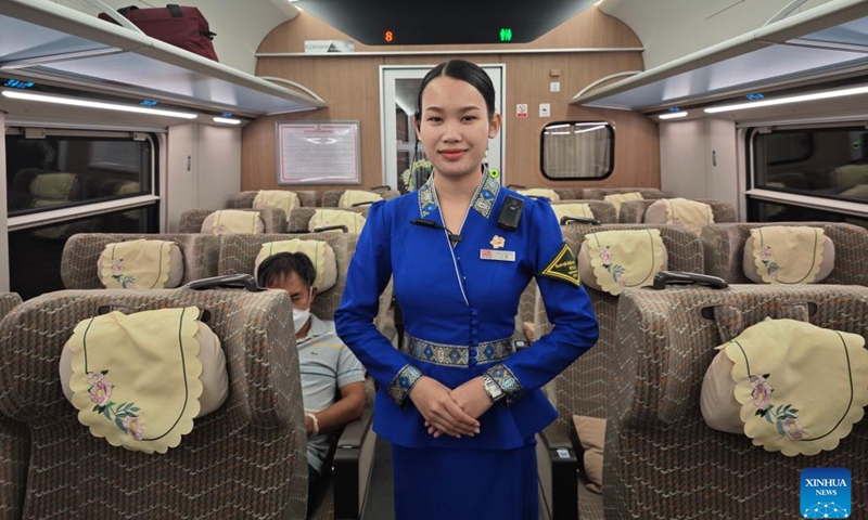 Chief conductor Bounmee works on a bullet train on the China-Laos Railway in Laos, Dec. 4, 2023.(Photo: Xinhua)