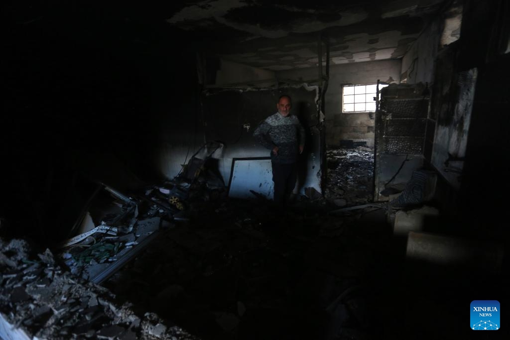 A man inspects a building destroyed during an Israeli raid in the West Bank city of Jenin, on Dec. 6, 2023.(Photo: Xinhua)