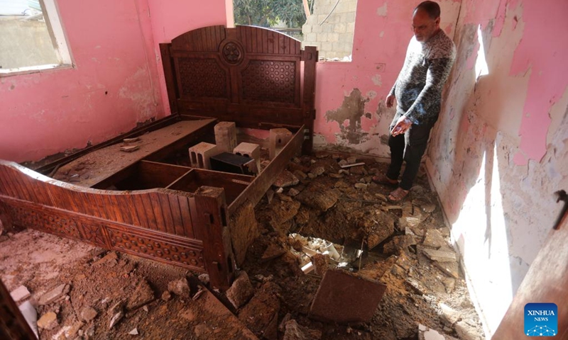 A man inspects a building destroyed during an Israeli raid in the West Bank city of Jenin, on Dec. 6, 2023.(Photo: Xinhua)