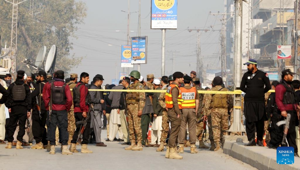 Security personnel examine the blast site in Peshawar, Pakistan, Dec. 5, 2023. Seven people including four children were injured in a blast outside a school in Pakistan's northwest Khyber Pakhtunkhwa province on Tuesday, rescue teams said.(Photo: Xinhua)