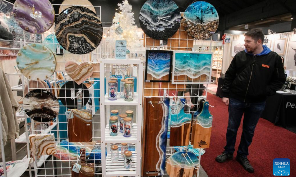 A person visits the Make It show in Vancouver, British Columbia, Canada, Dec. 8, 2023. The trade event dedicated to handmade items features exhibitors from across Canada, offering a diverse range of handmade goods. Photo:Xinhua
