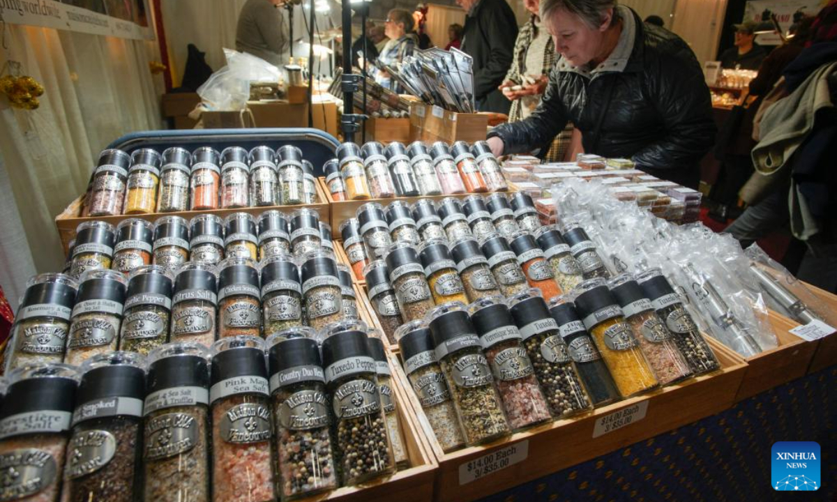 People visit the Make It show in Vancouver, British Columbia, Canada, Dec. 8, 2023. The trade event dedicated to handmade items features exhibitors from across Canada, offering a diverse range of handmade goods. Photo:Xinhua