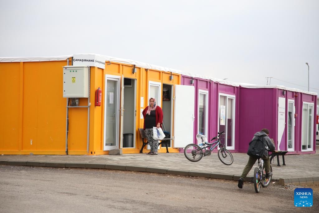 This photo taken on Dec. 6, 2023 shows a community built with containers in Kahramanmaras, Türkiye. Many communities have been built with containers in Kahramanmaras after the massive earthquakes in February this year. They are equipped with schools, banks, supermarkets, laundries, drug stores, etc. The largest community can provide accommodation for around 7,000 locals.(Photo: Xinhua)