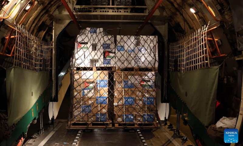 Humanitarian goods prepared for the Gaza Strip are loaded onto a plane at the Marka Military Airport in Amman, Jordan, Dec. 6, 2023. The plane will arrive at Al Arish Airport near the Rafah border crossing between Egypt and the Gaza Strip.(Photo: Xinhua)