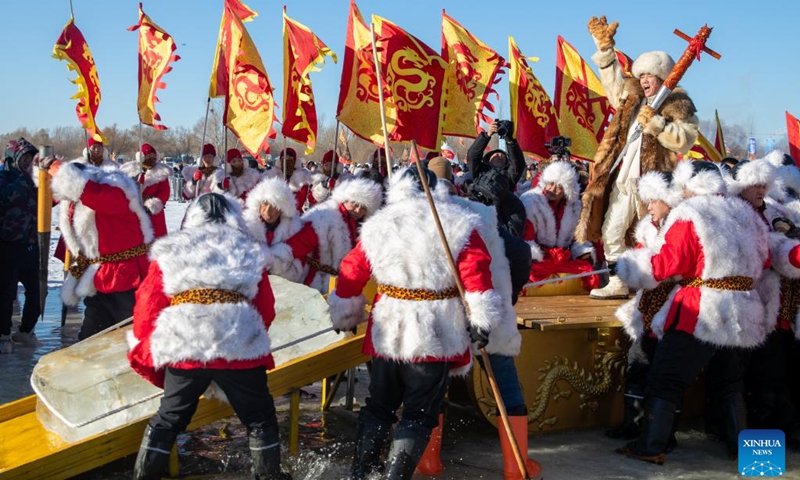 Workers collect ice from the Songhua River in Harbin, capital of northeast China's Heilongjiang Province, Dec. 7, 2023. Ice cubes collected from the frozen Songhua River will be used in decoration of the city.(Photo: Xinhua)