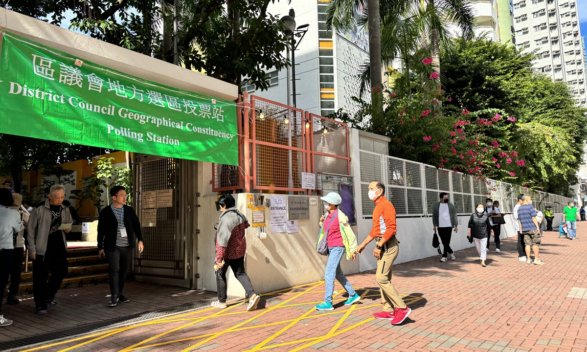 Local residents walk into a polling station in Yaumatei Catholic Primary School in Hong Kong on Sunday morning to cast their votes for 7th District Council Election. Photo: Chen Qingqing/GT