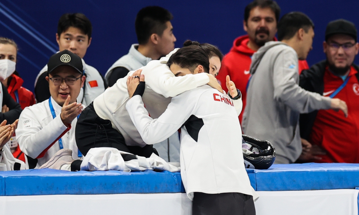 Liu Shaoang (center) celebrates with coach Zhang Jing after winning gold at the ISU World Cup on December 10, 2023 in Beijing. Photo: VCG