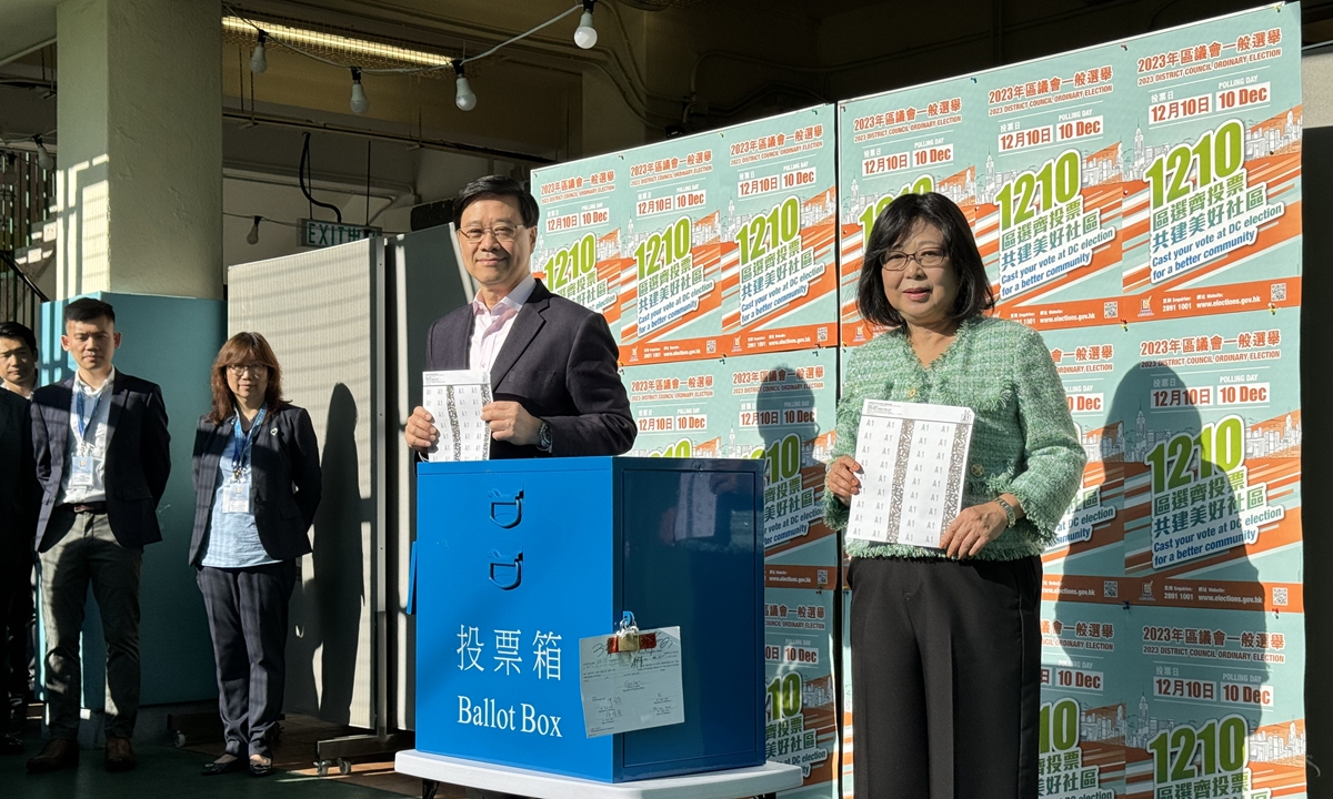 The Hong Kong Special Administrative Region Chief Executive John Lee and his wife Janet Lee Lam cast their votes at the polling station at 2 Robinson Road, Raimondi College on December 10, 2023. Photo: Chen Qingqing/GT
