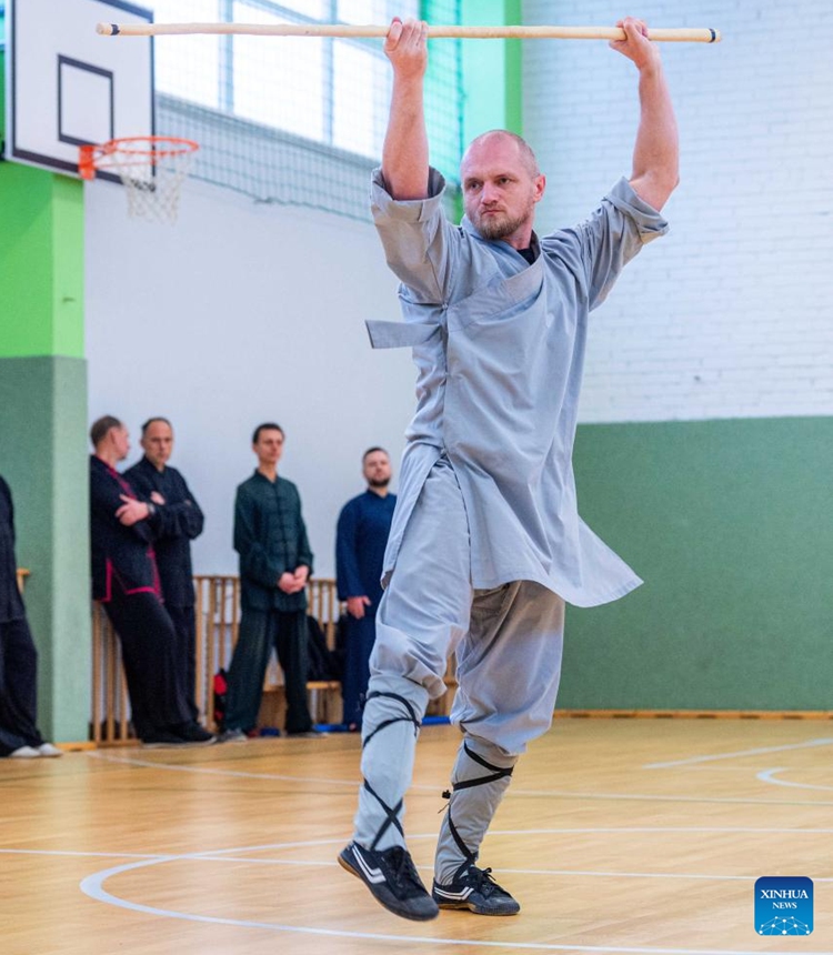 A participant performs at the Chinese Wushu (Kung Fu) and Tai Chi Performance Competition held by Lithuanian Wushu Federation in Vilnius, Lithuania, Dec. 9, 2023. (Photo: Xinhua)
