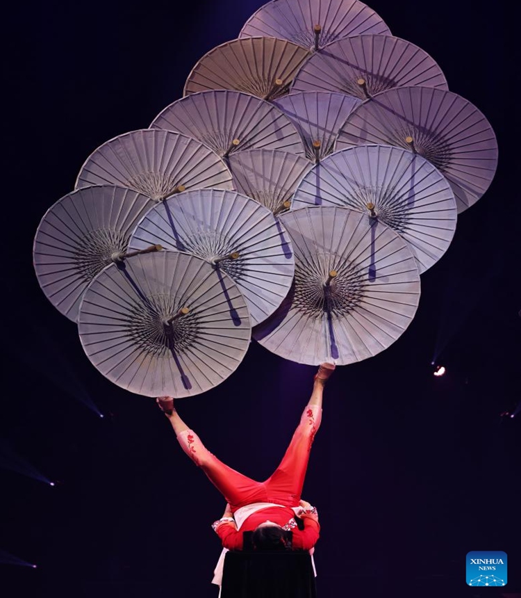 A Chinese acrobat performs during the fabulous night at Cirque Phoenix in Paris, France, Dec. 8, 2023. Acrobats from Dalian Cirque of China performed here on Friday night. (Photo: Xinhua)