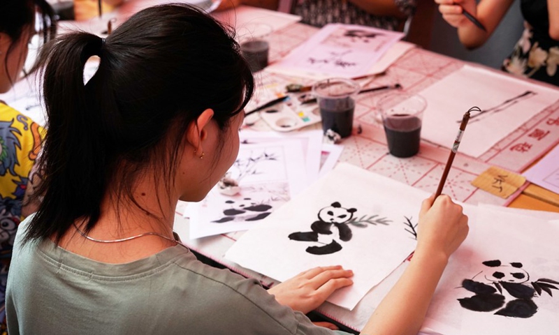 A Vietnamese student works on a Chinese painting during an event celebrating the 14th annual United Nations Chinese Language Day at Hanoi University in Vietnam, April 21, 2023. (Photo: Xinhua)