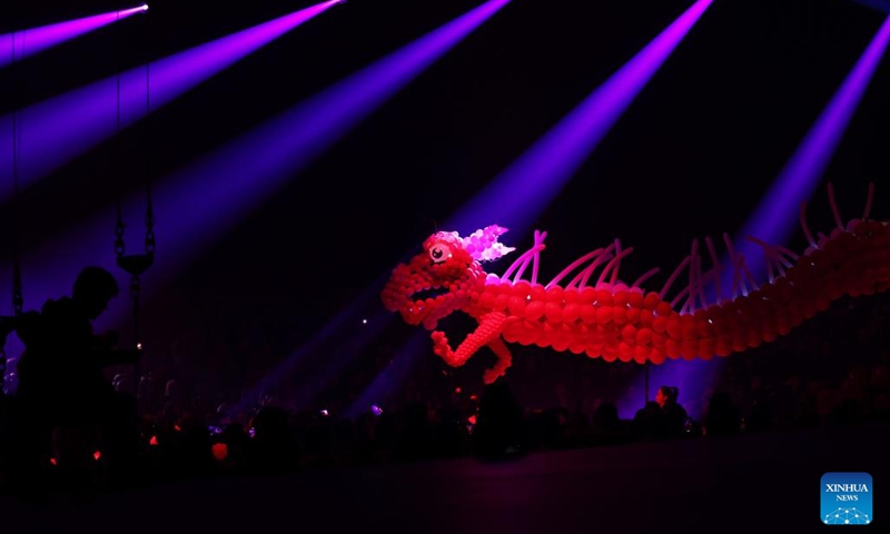 A balloon dragon is seen during the fabulous night at Cirque Phoenix in Paris, France, Dec. 8, 2023. Acrobats from Dalian Cirque of China performed here on Friday night. (Photo: Xinhua)