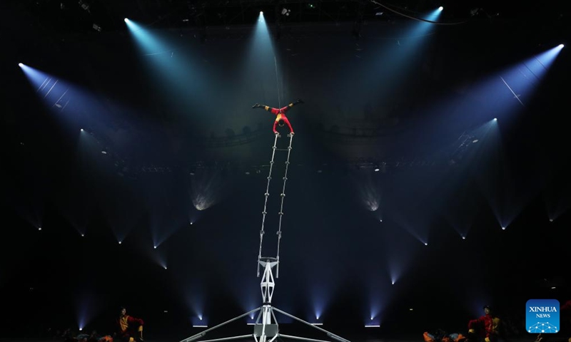 A Chinese acrobat performs during the fabulous night at Cirque Phoenix in Paris, France, Dec. 8, 2023. Acrobats from Dalian Cirque of China performed here on Friday night. (Photo: Xinhua)