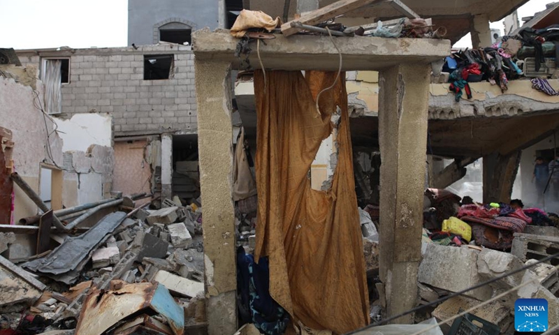 This photo taken on Dec. 10, 2023 shows damaged buildings after an Israeli airstrike in Maghazi refugee camp, central Gaza Strip.(Photo: Xinhua)