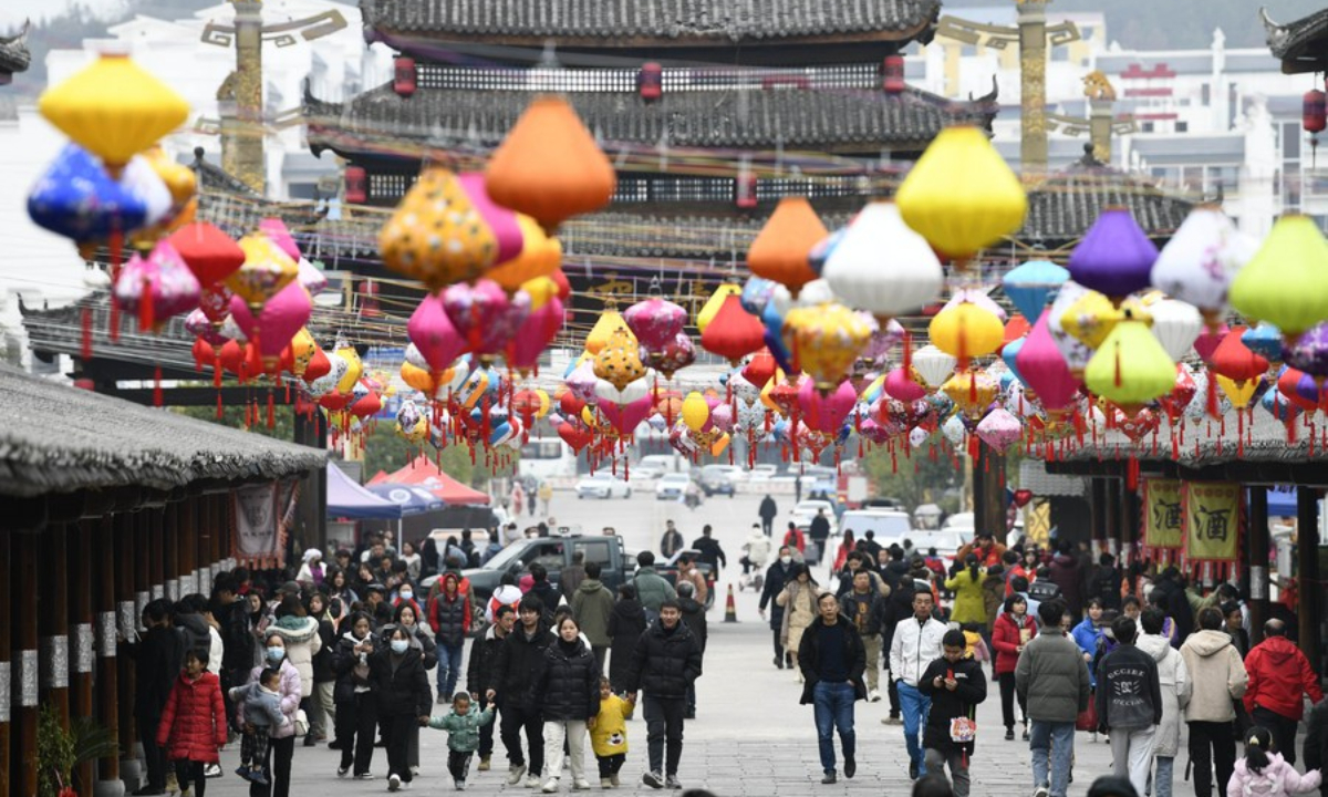 People tour Jiuzhou ancient town in Huangping County, southwest China's Guizhou Province, Jan 26, 2023. Photo:Xinhua
