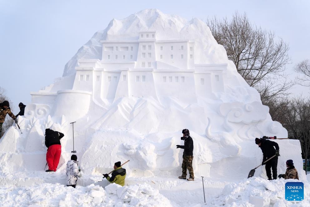 Sculptors work on a giant snow sculpture at the Sun Island scenic area in Harbin, northeast China's Heilongjiang Province, Dec. 12, 2023. With numerous snow sculptures constructed in the theme park titled snow world, the city of Harbin, known as China's ice city in the northeast, is witnessing the coming of its high season for tourism.(Photo: Xinhua)