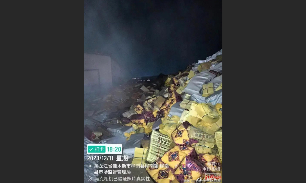 Large quantities of confiscated ghost money are piled up in the courtyard of the local market supervision bureau in Huanan county, Jiamusi city, in Northeast China’s Heilongjiang Province. Photo: Sina Weibo