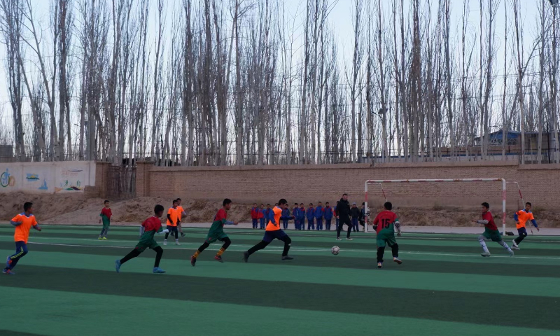 Students at Eksak Elementary School play a football game in Artux City, Northwest China's Xinjiang Uygur Autonomous Region. Photo: Xu Keyue/GT