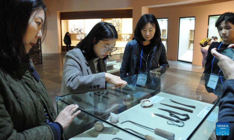 Tourists visit the Haenyeo museum in Jeju Island, South Korea, Dec. 15, 2023. Haenyeo refers to female divers who dive into the sea to gather various shellfish and seaweed without using any underwater diving equipment. The Culture of Jeju Haenyeo was inscribed in 2016 on the UNESCO Representative List of the Intangible Cultural Heritage of Humanity. (Photo by Yang Chang/Xinhua)