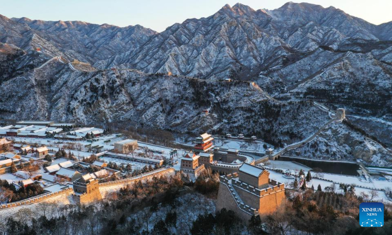 This aerial photo taken on Dec. 16, 2023 shows the snow scenery at the Juyongguan section of the Great Wall in the sunlight in Beijing, capital of China. (Xinhua/Chen Yehua)