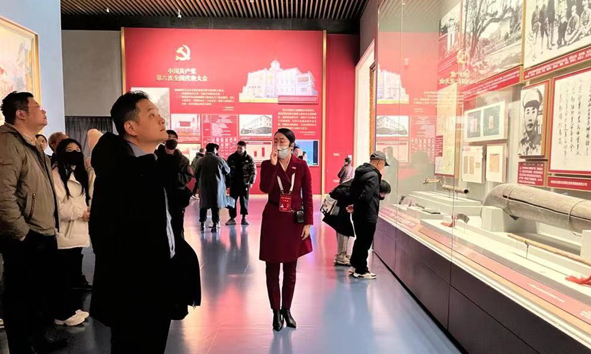 Members of a delegation from the Chief Executive Policy Unit listen carefully to the guide when they visit the Museum of the Communist Party of China in Beijing on December 3, 2023. Photo: Courtesy of the Chief Executive’s Policy Unit