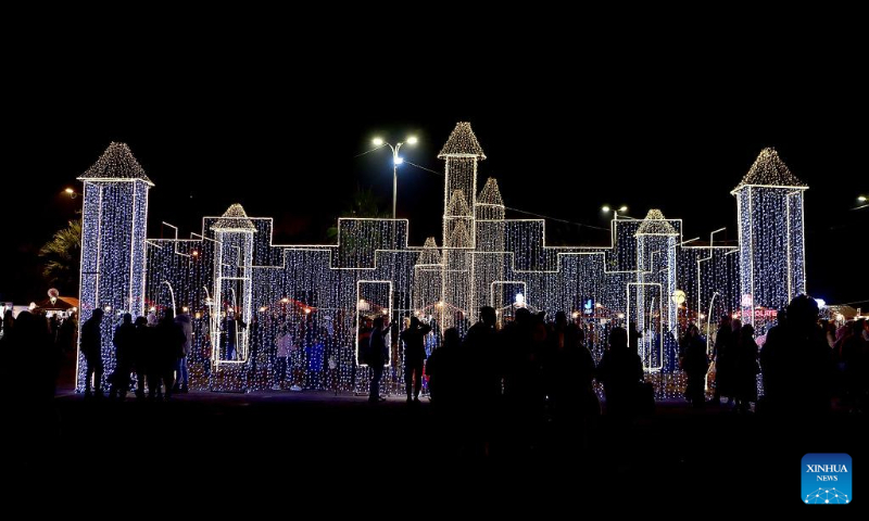 People visit a Christmas bazaar in Damascus, Syria, Dec. 16, 2023. (Photo by Ammar Safarjalani/Xinhua)
