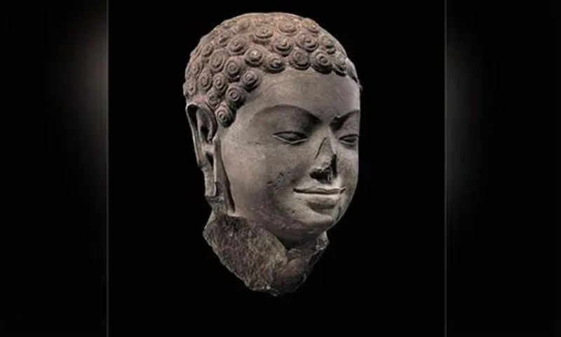 A head of Buddha from seventh century is one of the artifacts to be returned to Cambodia by the Met. Photo: Courtesy of US Department of Justice