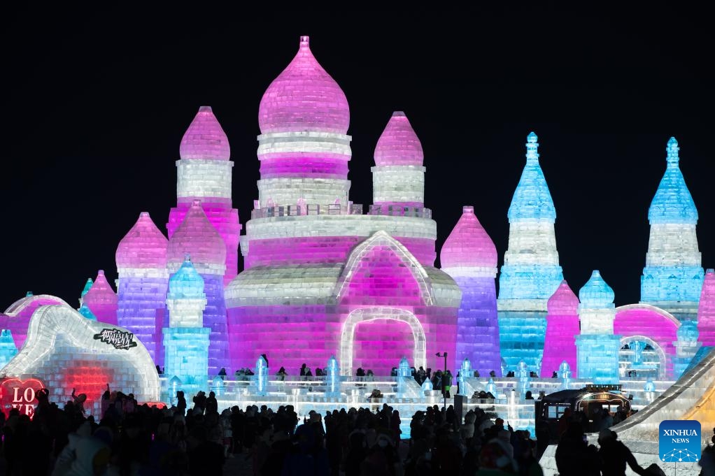 Tourists visit the Harbin Ice-Snow World in Harbin, northeast China's Heilongjiang Province, Dec. 18, 2023. The renowned Harbin Ice-Snow World opened to the public on Monday. Over 1,000 appealing ice and snow landscapes and sculptures have been built in the park for people to enjoy. The park aims to integrate arts, culture, performance, architecture and sports to showcase the charm of ice and snow.(Photo: Xinhua)