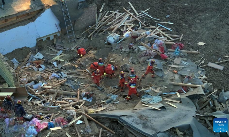 This aerial photo taken on Dec. 19, 2023 shows rescuers in operation at Caotan Village of Minhe Hui and Tu Autonomous County in Haidong City, northwest China's Qinghai Province. Eleven people have been confirmed dead in northwest China's Qinghai Province, after a 6.2-magnitude earthquake jolted the neighboring Gansu Province late Monday evening, according to local authorities.(Photo: Xinhua)