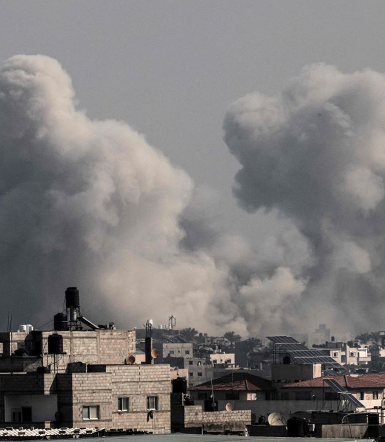 Smoke billows over the southern Gaza Strip during Israeli bombardment on December 17, 2023, amid continuing battles between Israel and Hamas. Photo: AFP