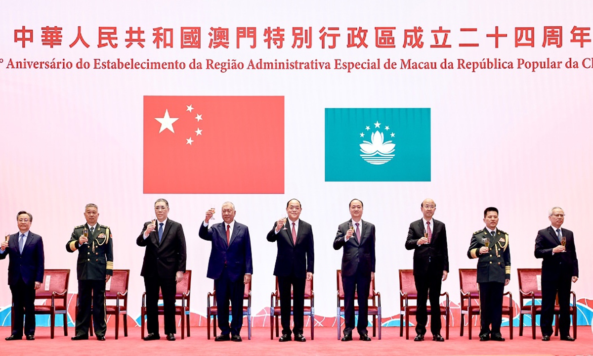 Ho Iat Seng, chief executive of the Macao Special Administrative Region (center), attends a ceremony that marks the 24th anniversary of Macao's return to the motherland on December 20, 2023. Photo: Xinhua
