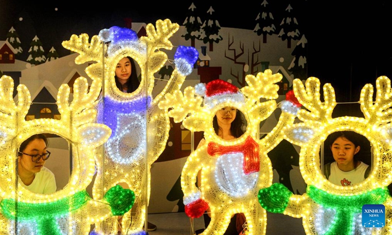 People visit Christmas Wonderland, a light show event, at Pakuwon City Mall in Surabaya, East Java, Indonesia, Dec. 18, 2023.(Photo: Xinhua)