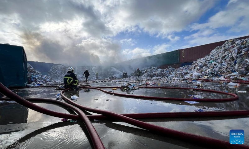 Firefighters work to extinguish a fire at a waste management complex in Maghtab, Naxxar, Malta, on Dec. 23, 2023. The waste management complex caught fire on Saturday morning. (Photo by Jonathan Borg/Xinhua)
