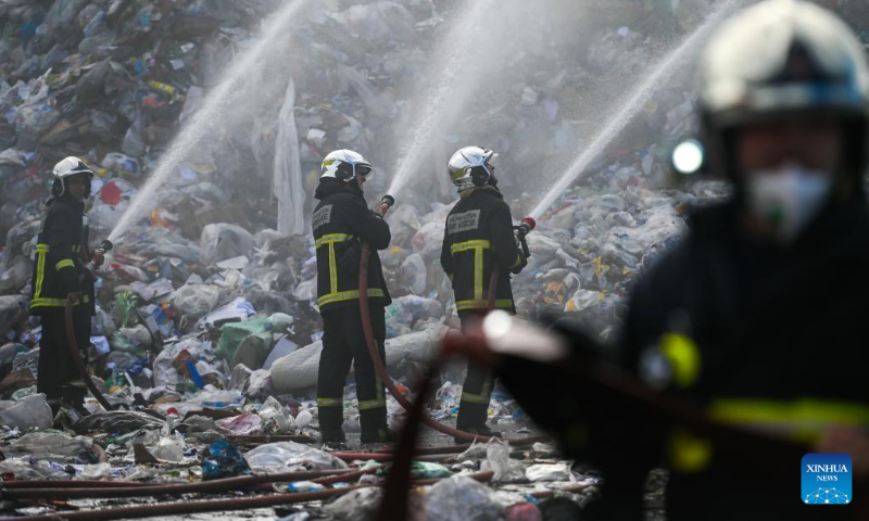 Firefighters work to extinguish a fire at a waste management complex in Maghtab, Naxxar, Malta, on Dec. 23, 2023. The waste management complex caught fire on Saturday morning. (Photo by Jonathan Borg/Xinhua)