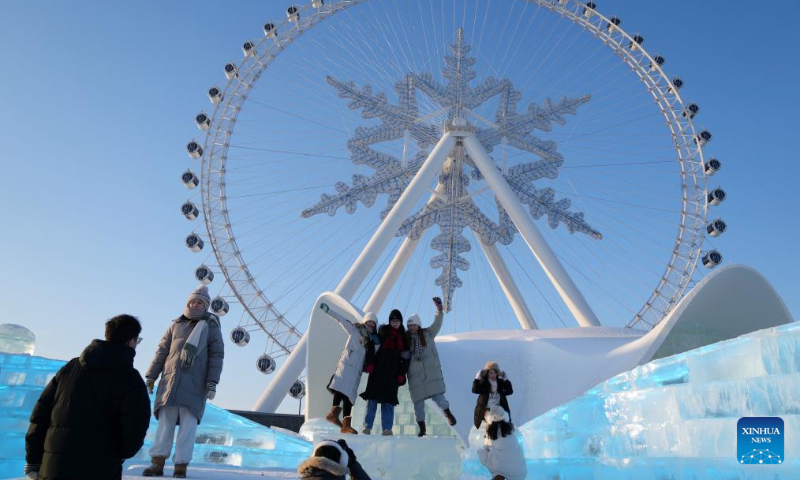 Tourists visit the Harbin Ice-Snow World in Harbin, northeast China's Heilongjiang Province, Dec. 31, 2023. Many tourists spent their last day of 2023 at Harbin Ice-Snow World, a renowned ice-and-snow theme park in northeast China's Heilongjiang Province. (Xinhua/Wang Jianwei)