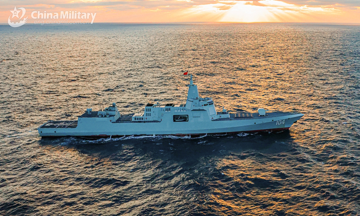 Type-055 guided-missile destroyer Wuxi attached to a unit with the navy under the PLA Northern Theater Command steams to the designated sea area during a maritime training exercise recently.Photo:chinamil.com.cn