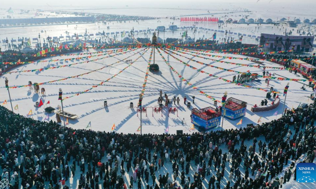 This aerial photo taken on Dec 28, 2023 shows a winter fishing-themed festival on the Chagan Lake in Songyuan City, northeast China's Jilin Province. Photo:Xinhua