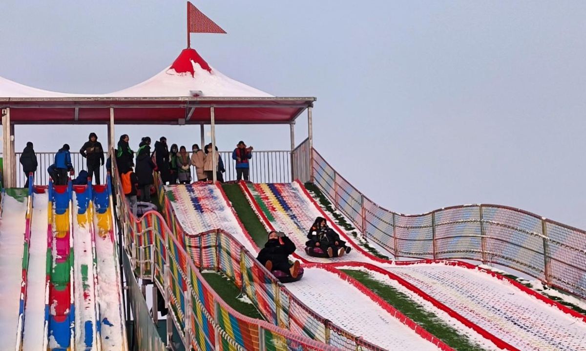 Teenagers play in the 3rd Ice and Snow Culture Tourism Festival in the Toutun River Valley Forest Park in Urumqi City, Xinjiang on December 19, 2023. Photo: Qian Jiayin/GT