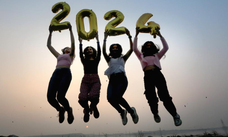 People celebrates on the eve of the New Year 2024 in Bhopal, India, Dec. 31, 2023. (Str/Xinhua)