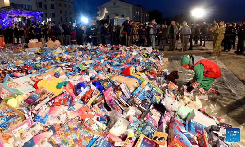 Charitable event of donating Christmas gifts for children in need held