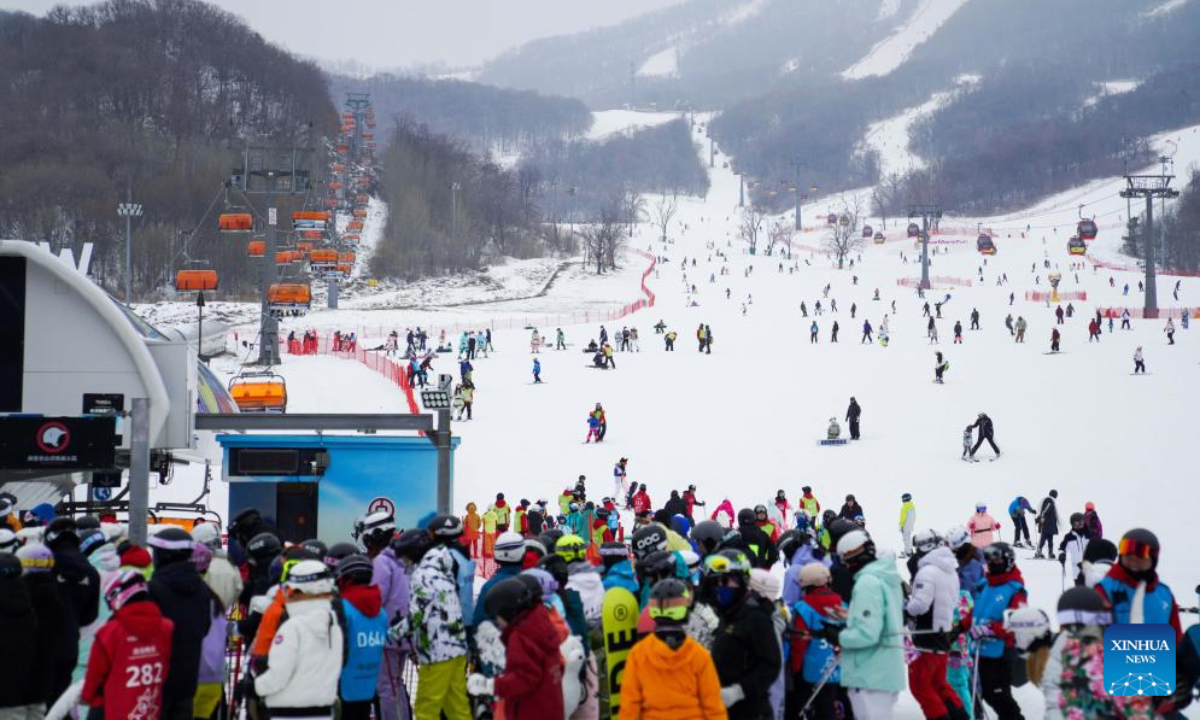 Tourists are seen at Lake Songhua Resort in Jilin City, northeast China's Jilin Province, Dec. 30, 2023. The three-day 2024 New Year holiday started on Saturday in China. (Photo: Xinhua)