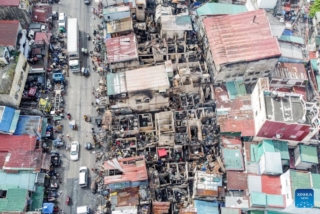This aerial photo shows damaged houses after a fire at a slum area in Manila, the Philippines on Dec. 20, 2023.(Photo: Xinhua)