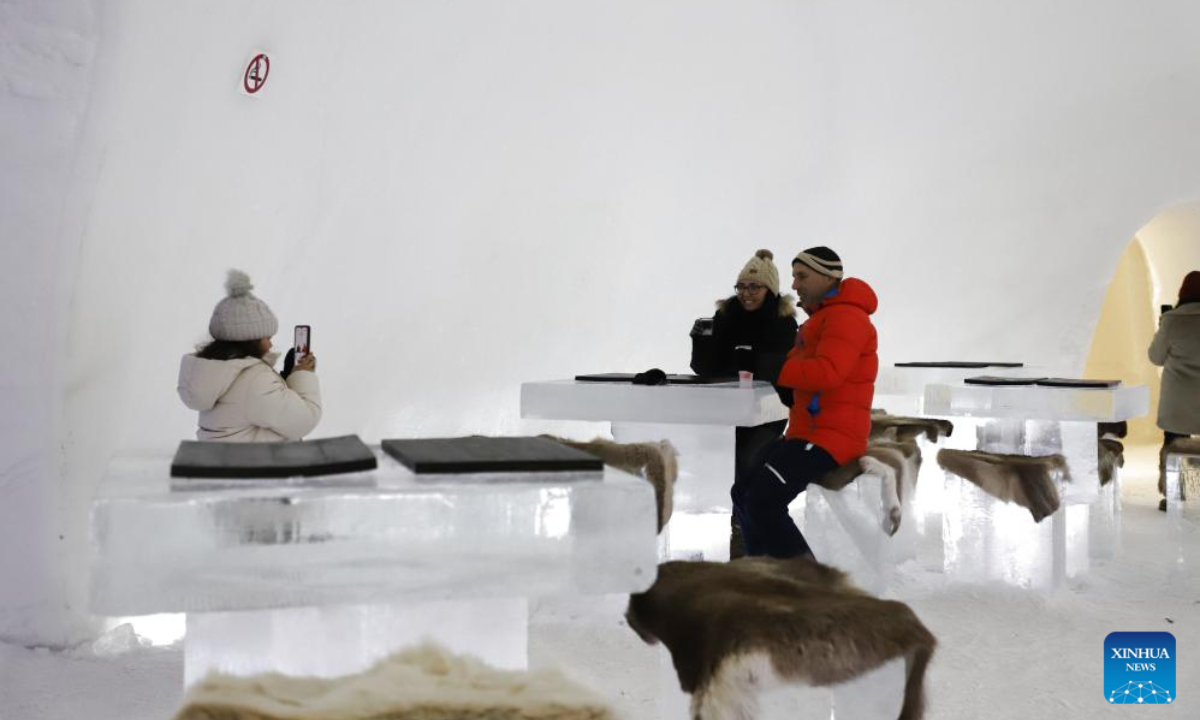 Tourists visit an ice hotel in Sinetta, Finland, Dec 28, 2023. An ice hotel with ice church, ice restaurant, ice bar and other facilities opened in Sinetta, attracting many tourists. Photo:Xinhua