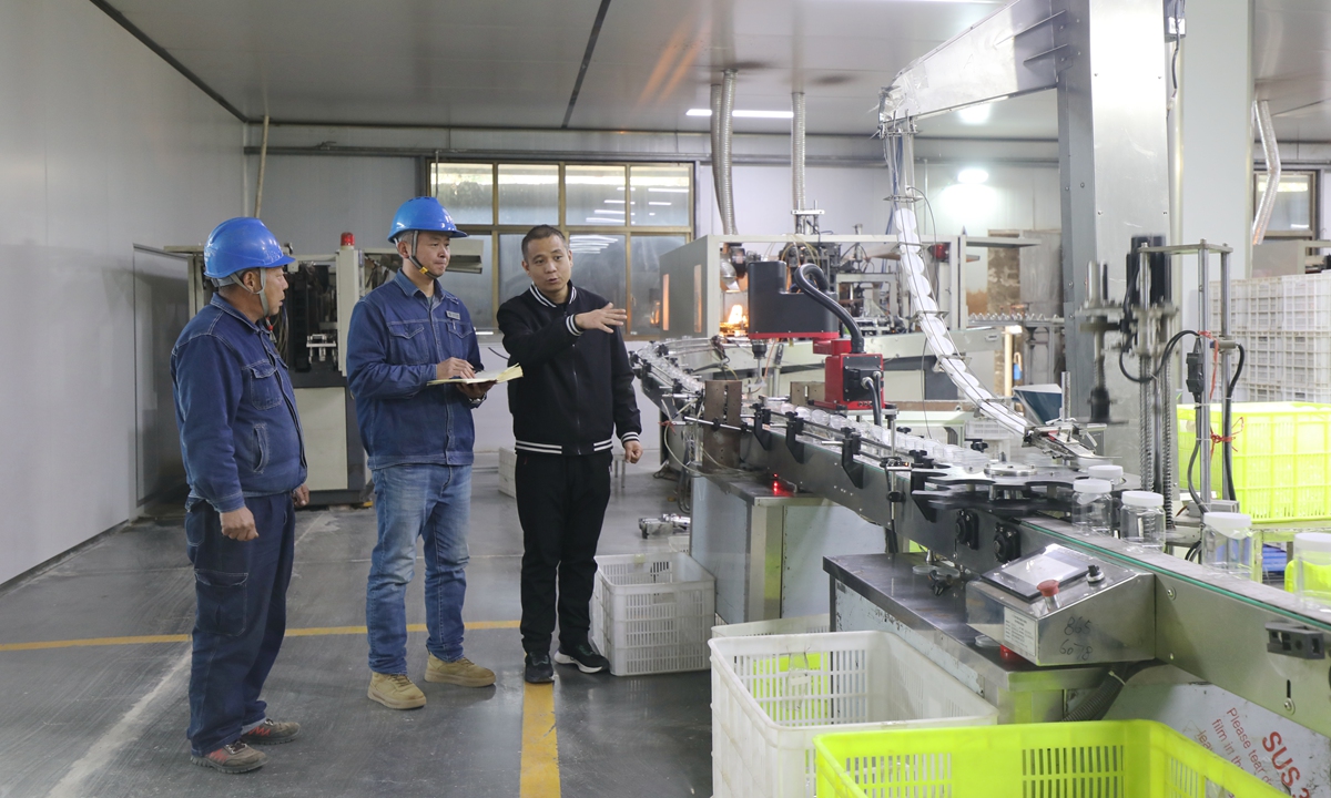 Staff members of the power supply company inspect on the production and electricity consumption of the enterprises.