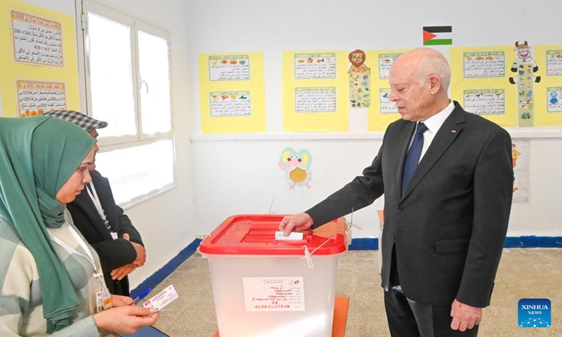 Tunisian President Kais Saied (1st R) registers and votes at a polling station in Tunis, Tunisia on Dec. 24, 2023. Voting for Tunisia's local council elections began on Sunday, the Independent High Authority for Elections (ISIE) said.(Tunisian Presidency/Handout via Xinhua)